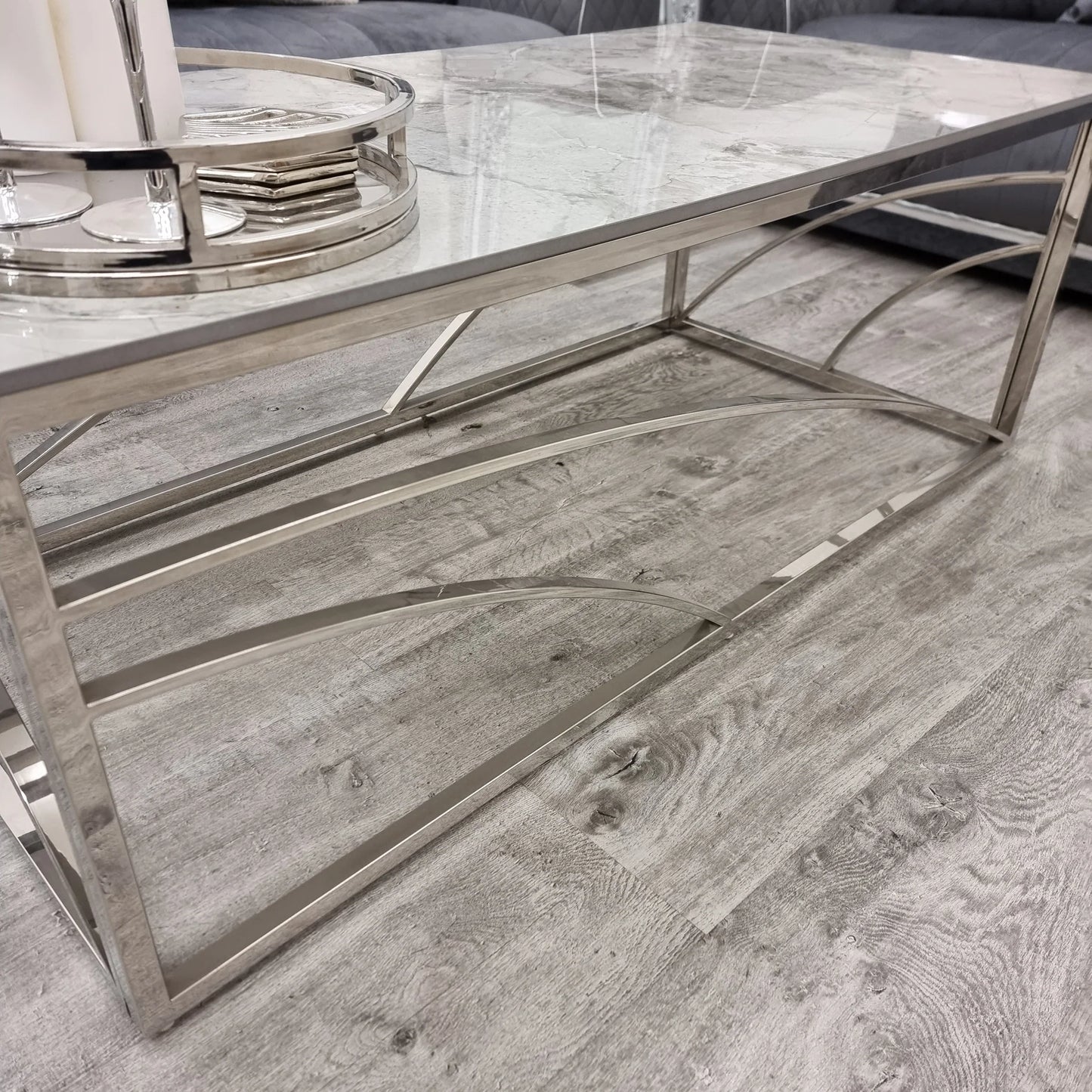 Shop today and enhance your living space with this Chrome Coffee Table, a perfect fusion of art deco inspired style and practicality, featuring a stunning marble effect Sintered Stone top. Shop online today at www.nobleandnook.co.uk