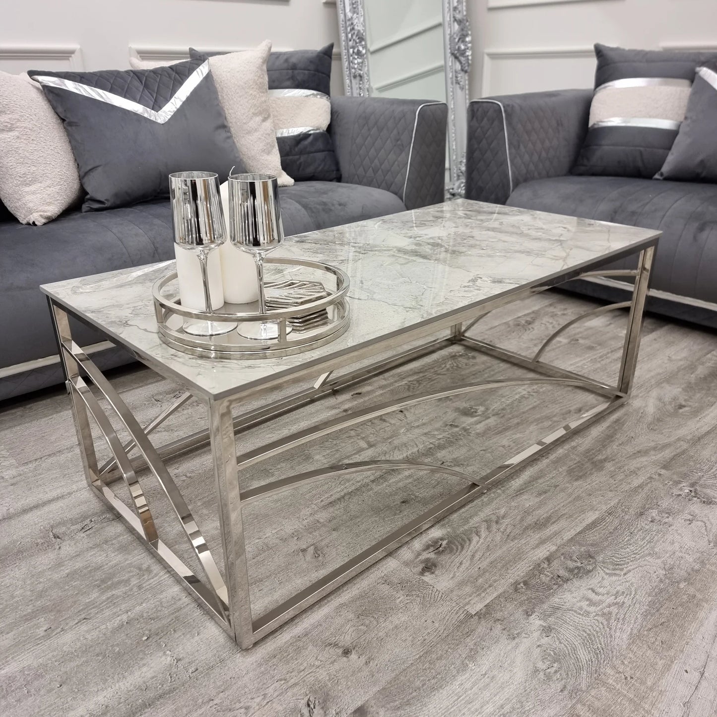 Shop today and enhance your living space with this Chrome Coffee Table, a perfect fusion of art deco inspired style and practicality, featuring a stunning marble effect Sintered Stone top. Shop online today at www.nobleandnook.co.uk