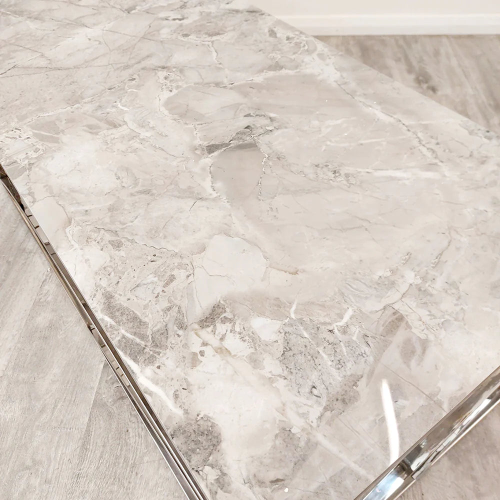 Shop today and enhance your living space with this Chrome Coffee Table, a perfect fusion of art deco inspired style and practicality, featuring a stunning marble effect Sintered Stone top. Shop online today at www.nobleandnook.co.uk