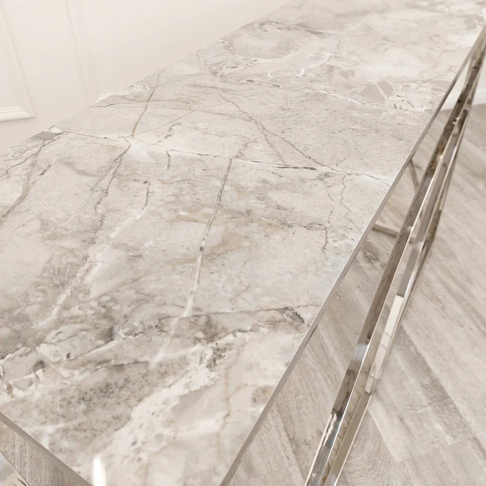 Shop now to define your interior design with this Chrome Framed art deco inspired Console Table, featuring a marble effect Sintered Stone top gold tone. Perfectly suited for hallways. Shop online today at www.nobleandnook.co.uk