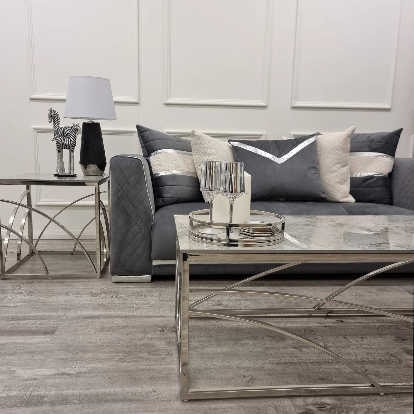 Shop today and enhance your living space with this Chrome Coffee Table, a perfect fusion of art deco inspired style and practicality, featuring a stunning marble effect Sintered Stone top. Shop online today at www.nobleandnook.co.uk