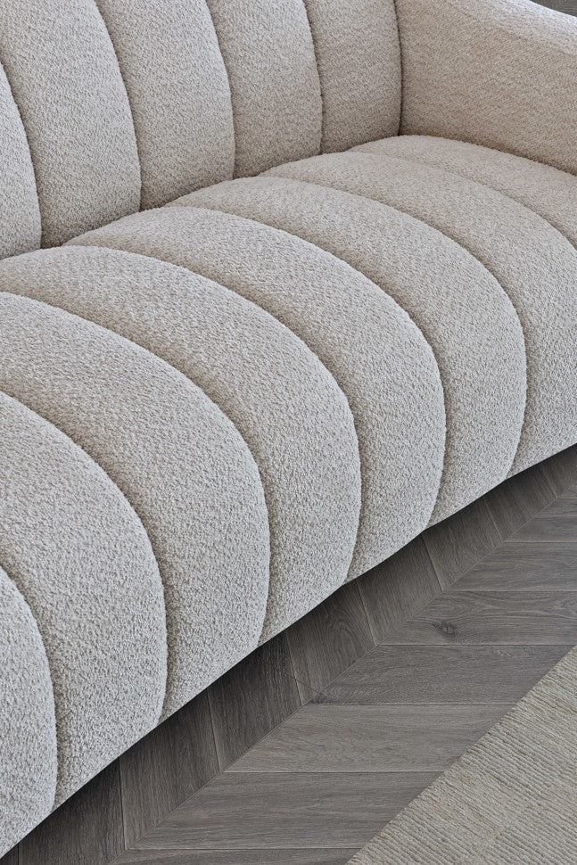 Indulge in luxury with the Aluxo Astoria 3 Seater Sofa in Oatmeal Boucle Fabric. An exquisite piece featuring deep channel stitching and adorned with a soft and alluring boucle fabric in a stunning Oatmeal hue. Shop online today at www.nobleandnook.co.uk
