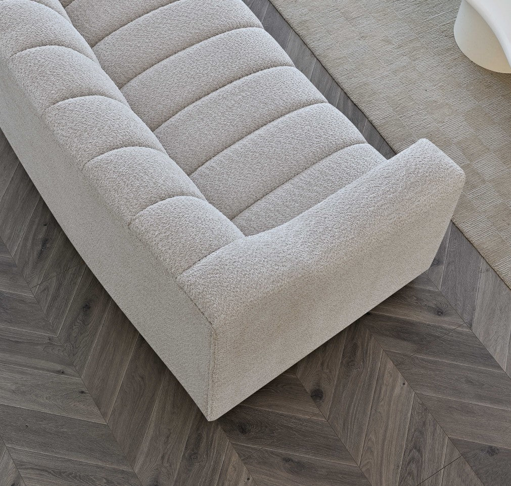 Indulge in luxury with the Aluxo Astoria 3 Seater Sofa in Oatmeal Boucle Fabric. An exquisite piece featuring deep channel stitching and adorned with a soft and alluring boucle fabric in a stunning Oatmeal hue. Shop online today at www.nobleandnook.co.uk