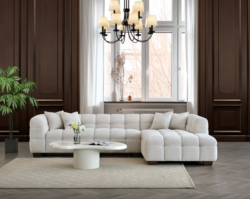 Shop the Tribeca Right Hand Corner Sofa featuring deep channel stitching, upholstered in an oatmeal boucle fabric. A modern twist on the classic Chesterfield design. Shop online today at www.nobleandnook.co.uk
