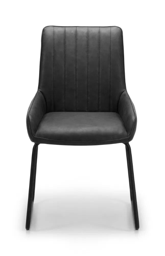 Shop these antique black faux leather dining chairs with sleek black metal frame for industrial edge. Retro styling with a modern twist – ideal for urban interiors. Shop online today at www.nobleandnook.co.uk