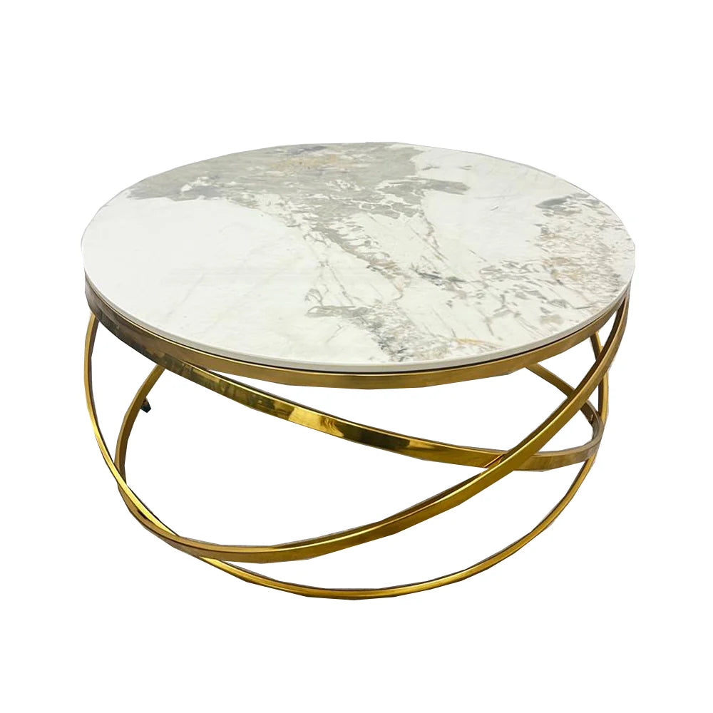 Adding a touch of modern luxury to your living space, the Spiro Round Coffee Table features a sleek design with a Pandora sintered stone top and an intricate gold metal frame. Shop online today at www.nobleandnook.co.uk