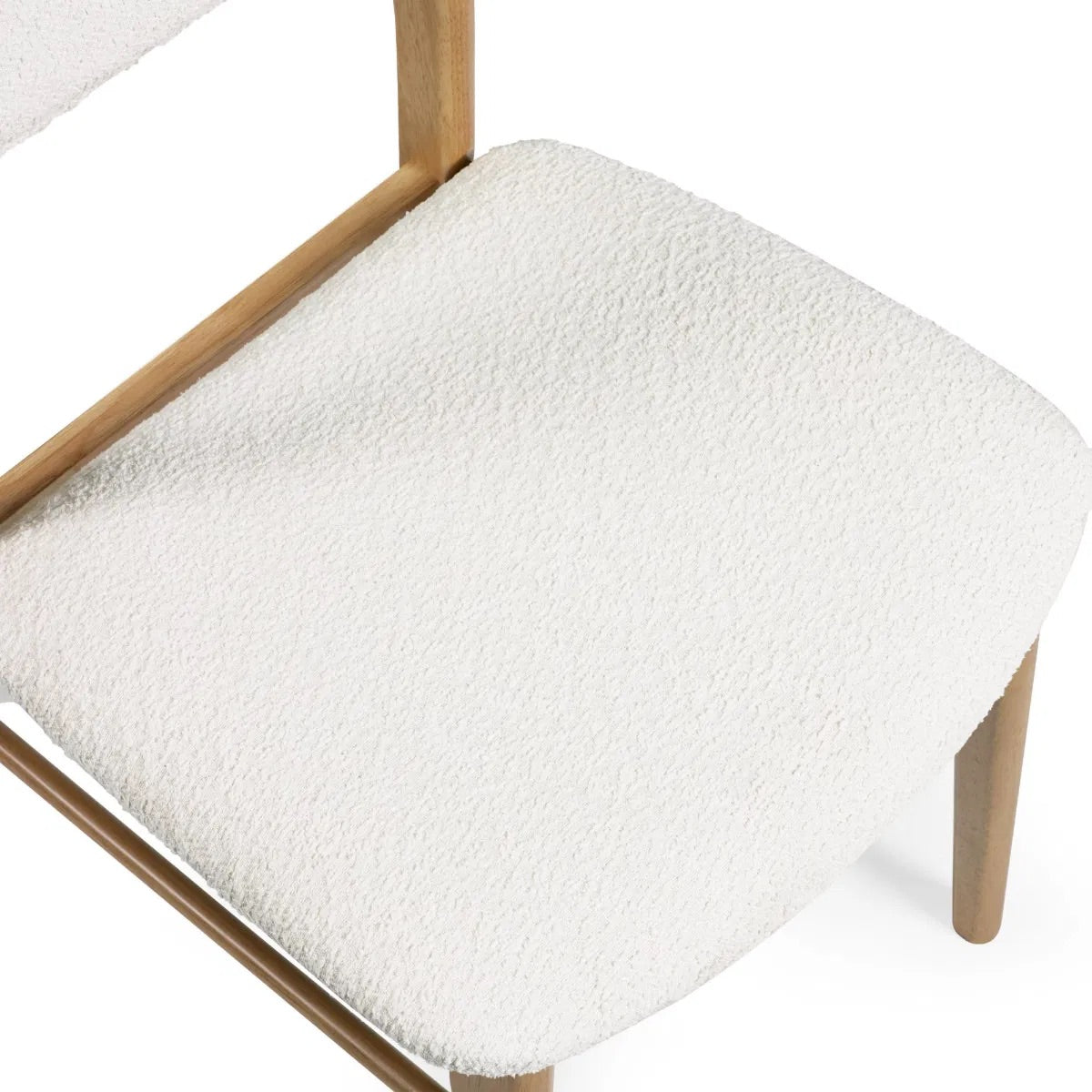 Dimensions: H85 x W56 x D45 cm. Luxurious White Boucle Upholstery adds a rich, tactile finish that feels both inviting and sophisticated. Ergonomically designed for lasting comfort and support during long meals and conversations.