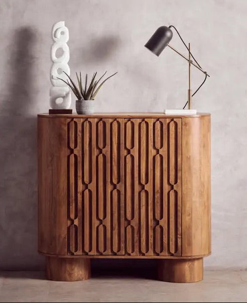 Shop the Torcino two door Mango Wood Cabinet in eco-friendly mango wood with intricately carved design. This item is pre-assembled. Shop online at www.nobleandnook.co.uk