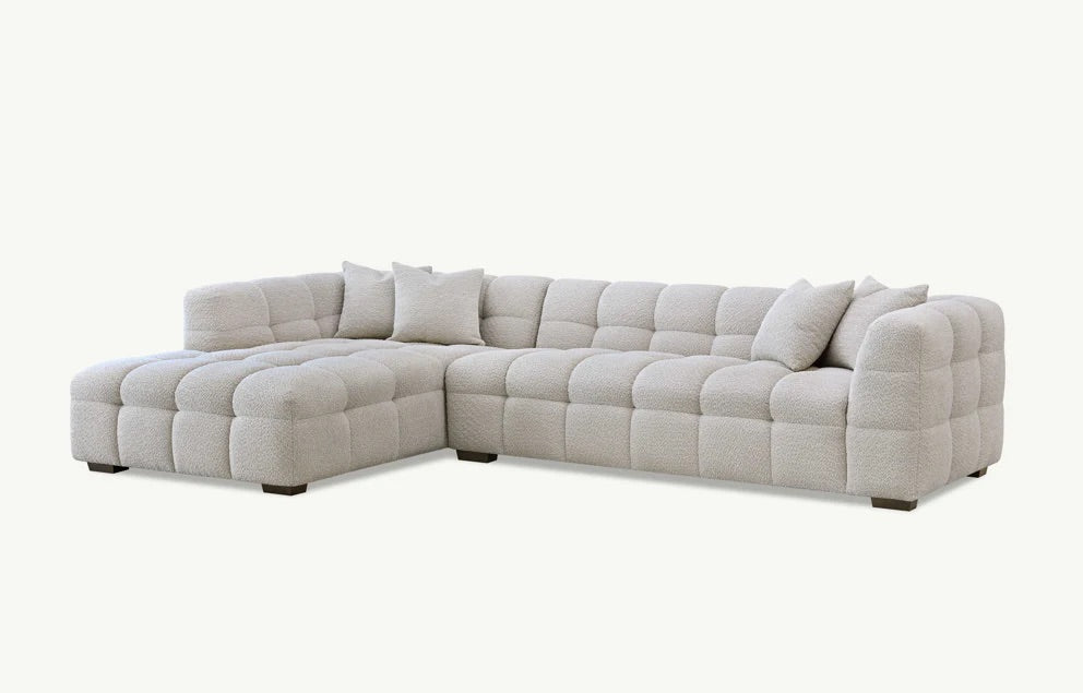 Shop the Tribeca Left Hand Corner Sofa featuring deep channel stitching, upholstered in an oatmeal boucle fabric. A modern twist on the classic Chesterfield design. Shop online today at www.nobleandnook.co.uk