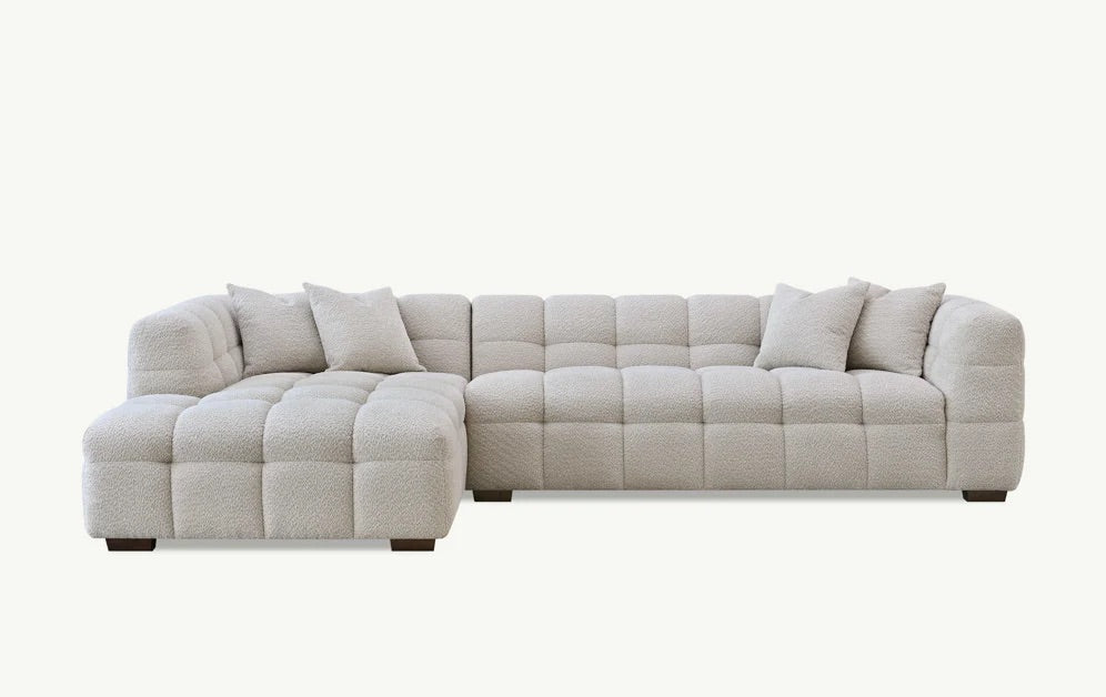 Shop the Tribeca Left Hand Corner Sofa featuring deep channel stitching, upholstered in an oatmeal boucle fabric. A modern twist on the classic Chesterfield design. Shop online today at www.nobleandnook.co.uk