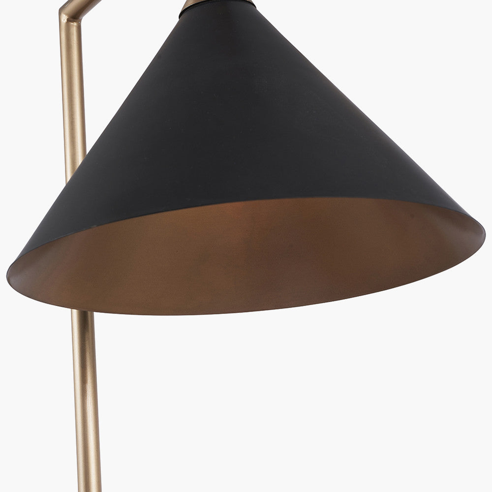 The Zeta Floor Lamp, featuring a sleek combination of matte black and antique brass metal. FREE UK MAINLAND DELIVERY. Shop online now at www.nobleandnook.co.uk