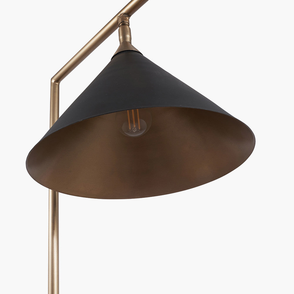 The Zeta Floor Lamp, featuring a sleek combination of matte black and antique brass metal. FREE UK MAINLAND DELIVERY. Shop online now at www.nobleandnook.co.uk