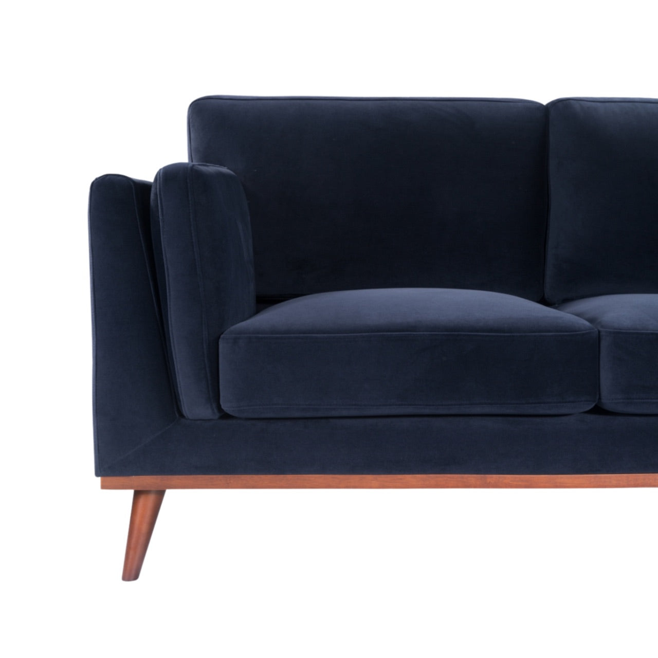 Shop the Mickey 2 seater sofa in Midnight Blue velvet with a walnut frame and tapered walnut legs, its a contemporary masterpiece. Shop online today at www.nobleandnook.co.uk