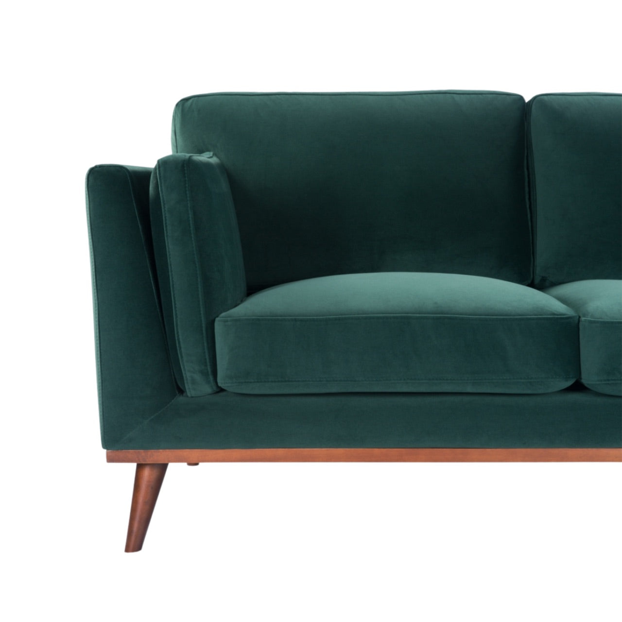Shop the Mickey 2 seater sofa in on trend Emerald Green velvet with a walnut frame and tapered walnut legs, a contemporary masterpiece. Shop online today at www.nobleandnook.co.uk