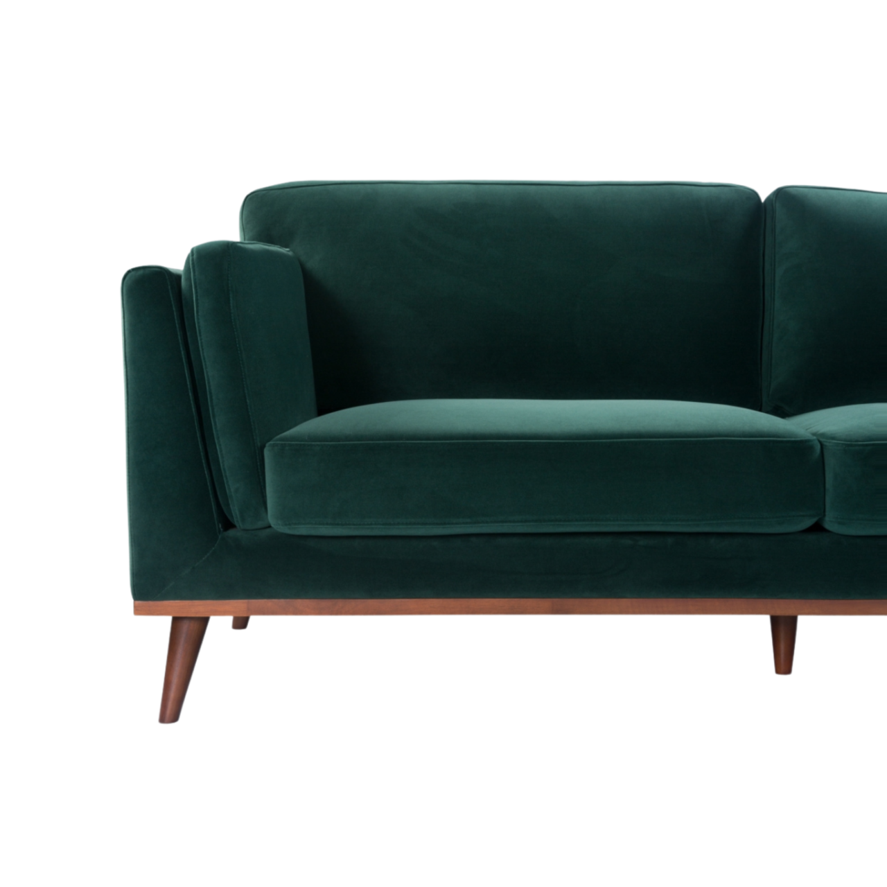 Shop the Mickey 3 Seat Sofa in a fashionable Emerald Green velvet with tapered walnut legs. This is a contemporary masterpiece. Shop online today at www.nobleandnook.co.uk