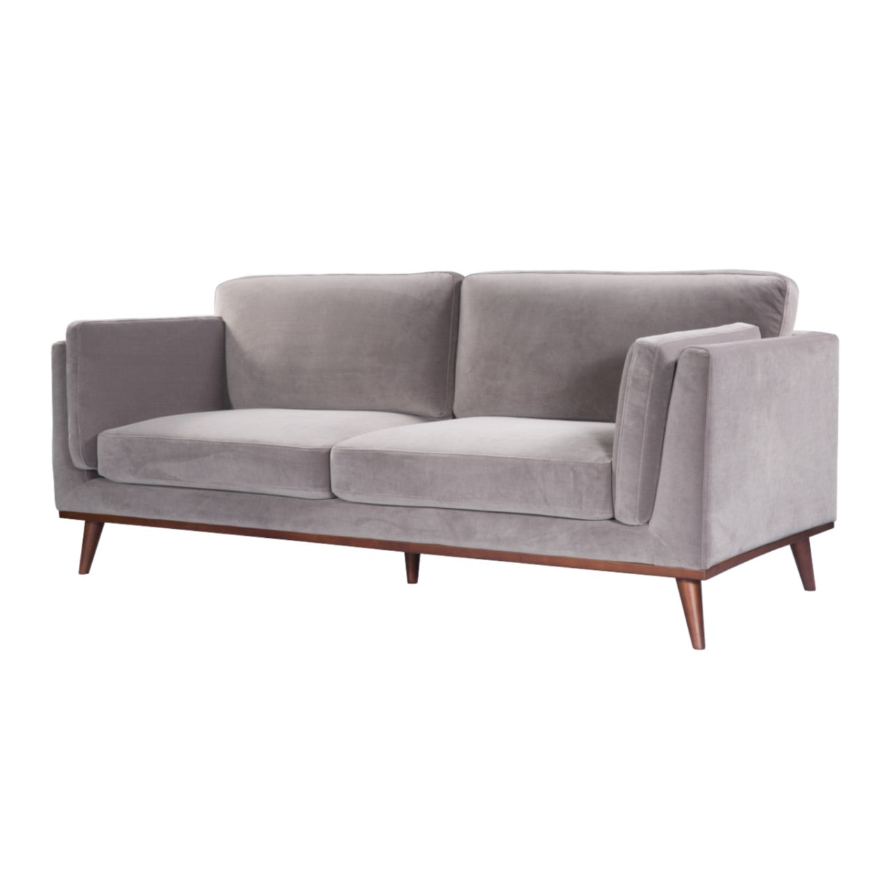 Shop the Mickey 3 Seat Sofa in a fashionable grey velvet hue with tapered walnut legs. This is a contemporary masterpiece. Shop online today at www.nobleandnook.co.uk