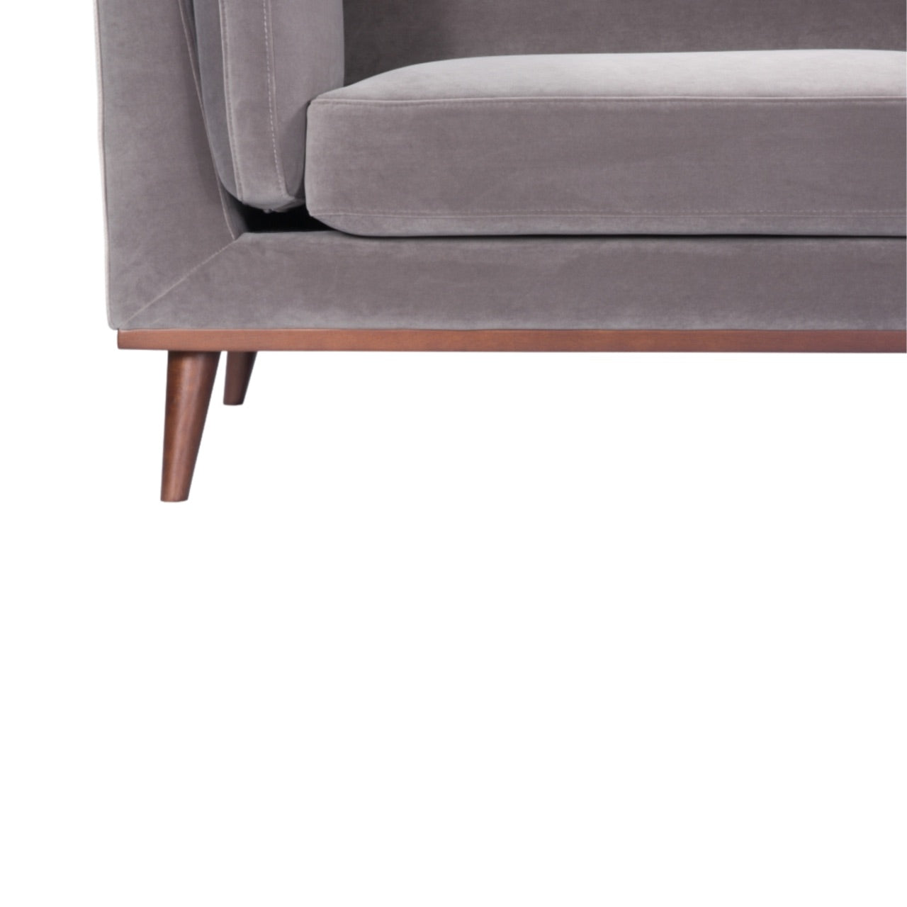 Shop the Mickey 3 Seat Sofa in a fashionable grey velvet hue with tapered walnut legs. This is a contemporary masterpiece. Shop online today at www.nobleandnook.co.uk