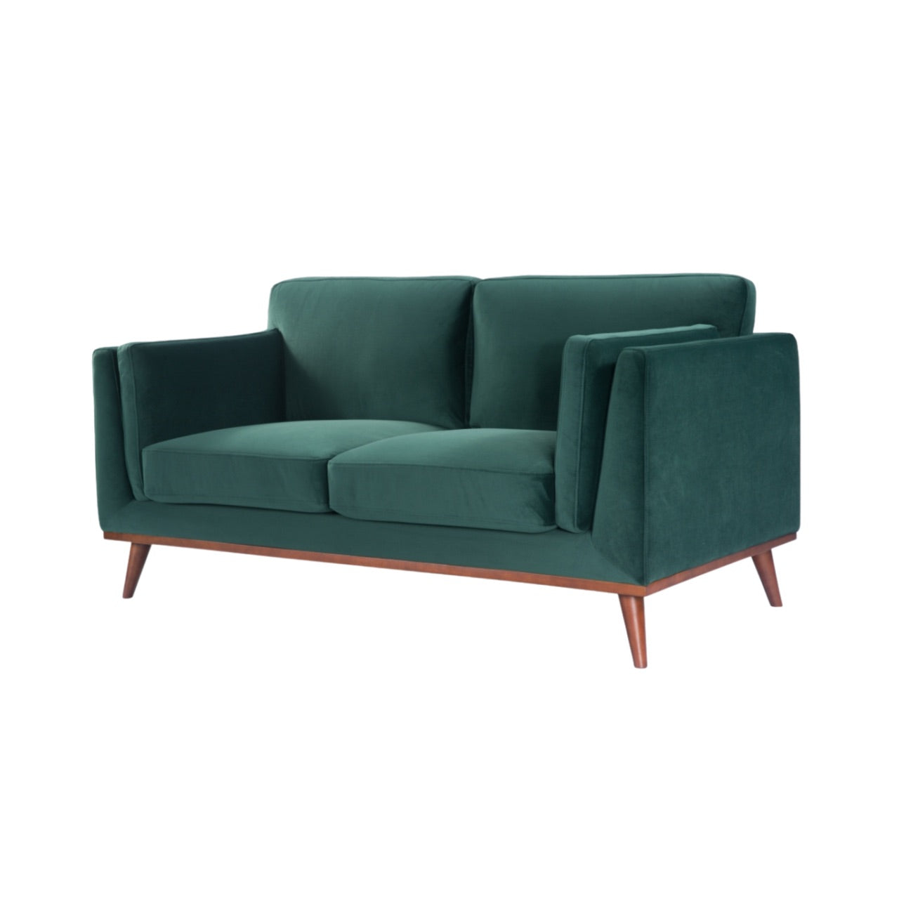 Shop the Mickey 2 seater sofa in on trend Emerald Green velvet with a walnut frame and tapered walnut legs, a contemporary masterpiece. Shop online today at www.nobleandnook.co.uk