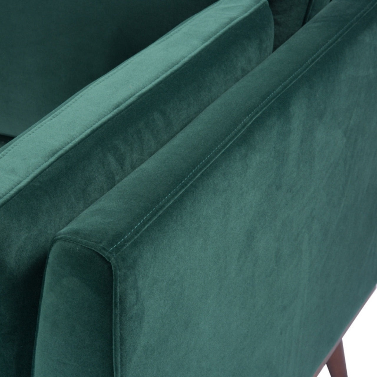 Shop the Mickey 2 seater sofa in on trend Emerald Green velvet with a walnut frame and tapered walnut legs, a contemporary masterpiece. Shop online today at www.nobleandnook.co.uk