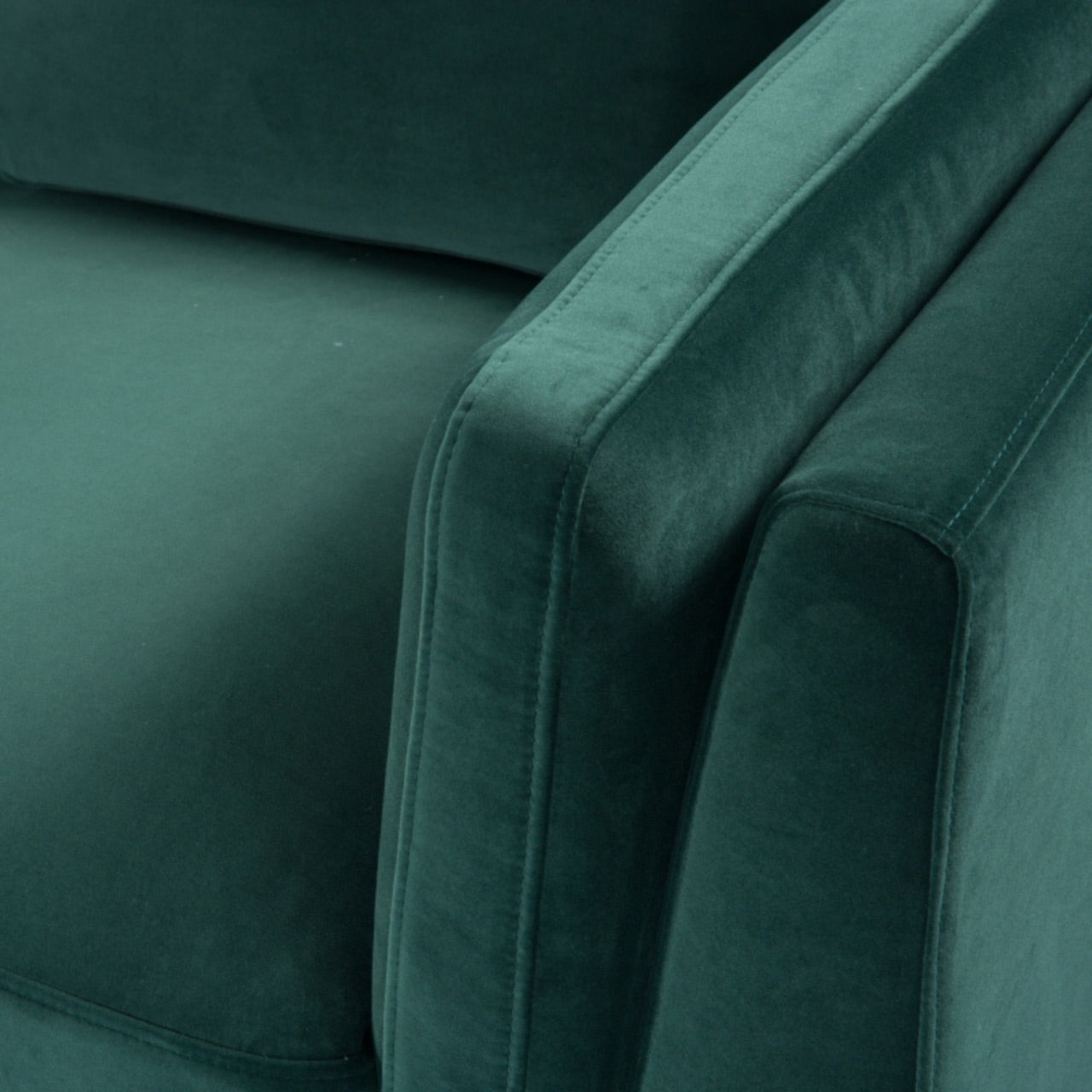 Shop the Mickey 2 seater sofa in on trend Emerald Green velvet with a walnut frame and tapered walnut legs, a contemporary masterpiece. Shop online today at www.nobleandnook.co.uk