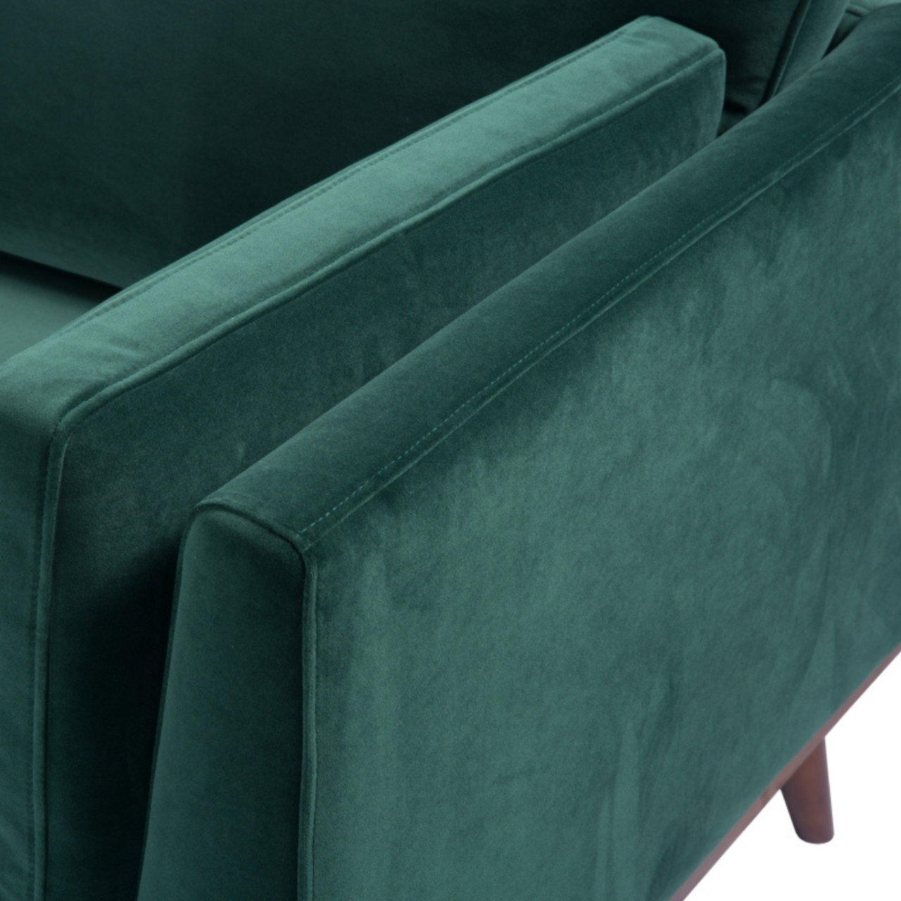 Shop the Mickey 3 Seat Sofa in a fashionable Emerald Green velvet with tapered walnut legs. This is a contemporary masterpiece. Shop online today at www.nobleandnook.co.uk