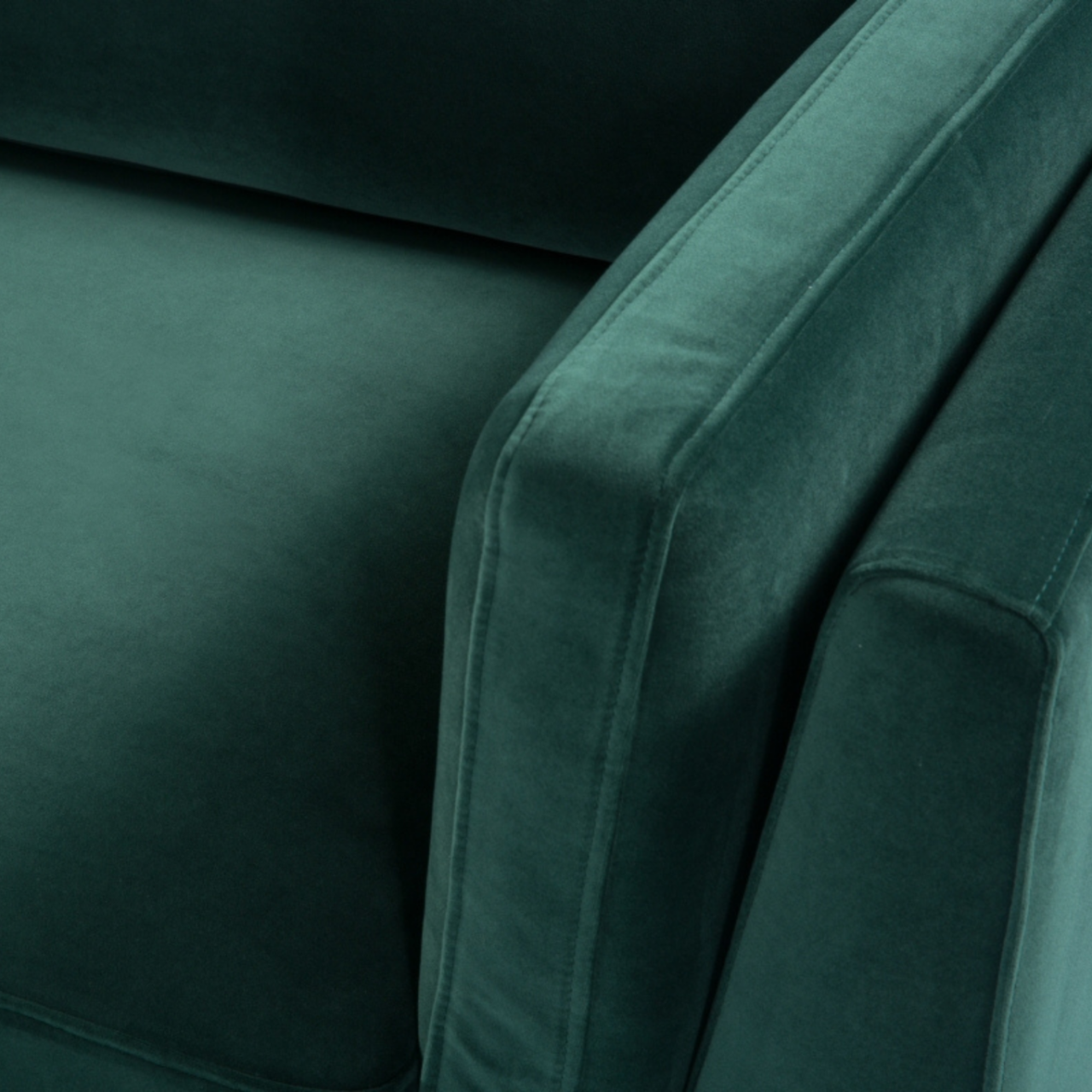 Shop the Mickey 3 Seat Sofa in a fashionable Emerald Green velvet with tapered walnut legs. This is a contemporary masterpiece. Shop online today at www.nobleandnook.co.uk