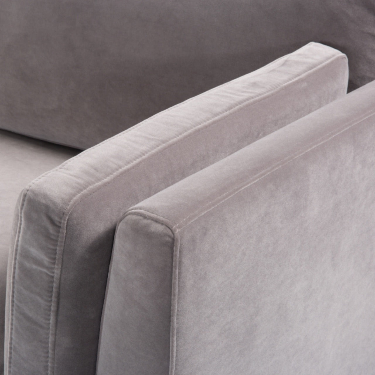 Shop the Mickey 3 Seat Sofa in a fashionable grey velvet hue with tapered walnut legs. This is a contemporary masterpiece. Shop online today at www.nobleandnook.co.uk
