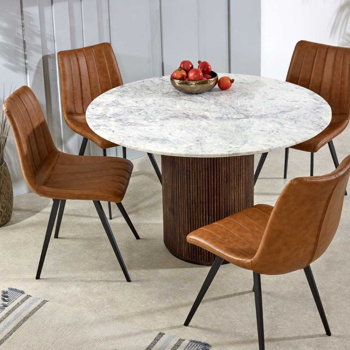 Luxurious white marble top with a sculptural base crafted from 100% solid mango wood for textural depth. Handmade in India using eco-friendly materials. H76×W120×D120cm. www.nobleandnook.co.uk