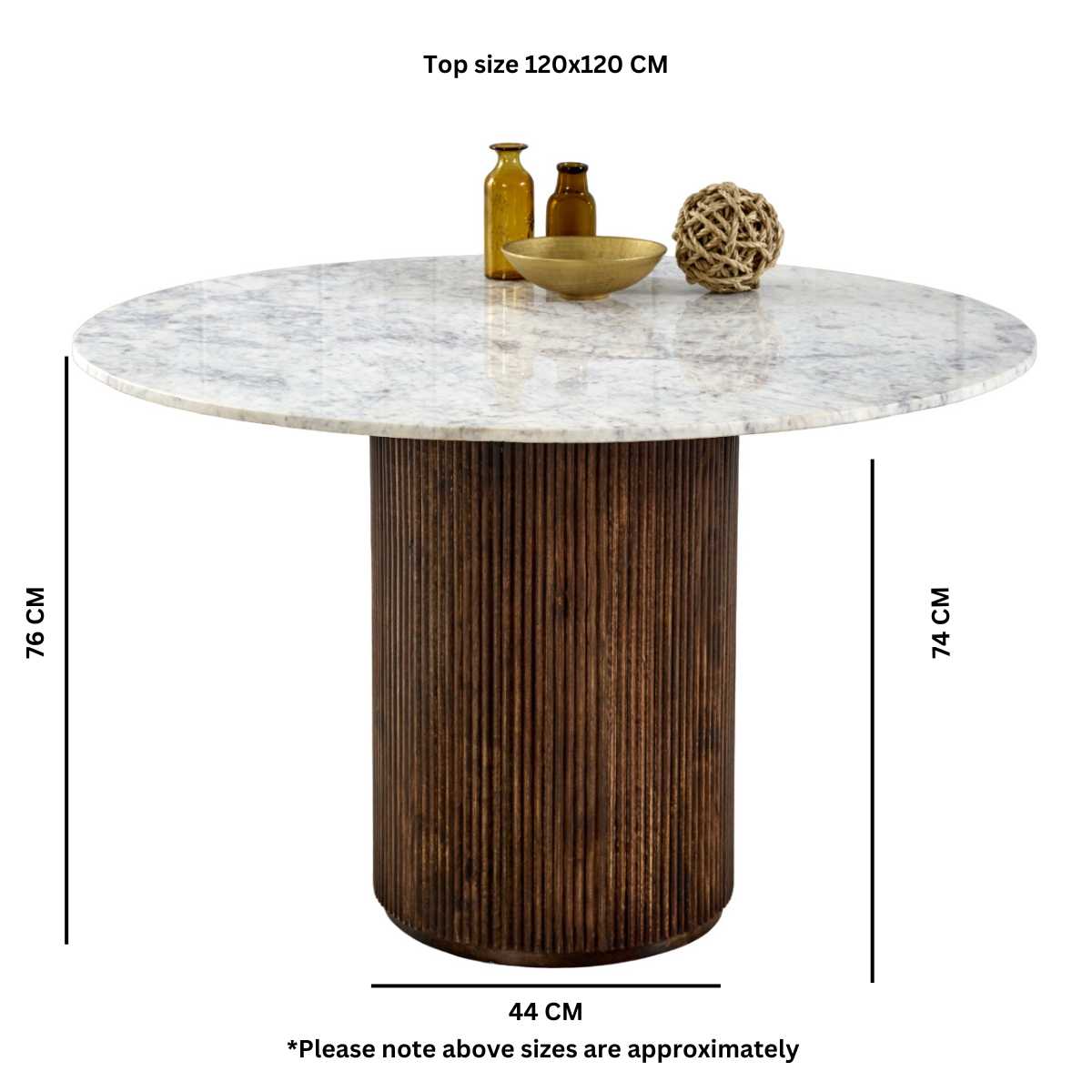 Luxurious white marble top with a sculptural base crafted from 100% solid mango wood for textural depth. Handmade in India using eco-friendly materials. H76×W120×D120cm. www.nobleandnook.co.uk