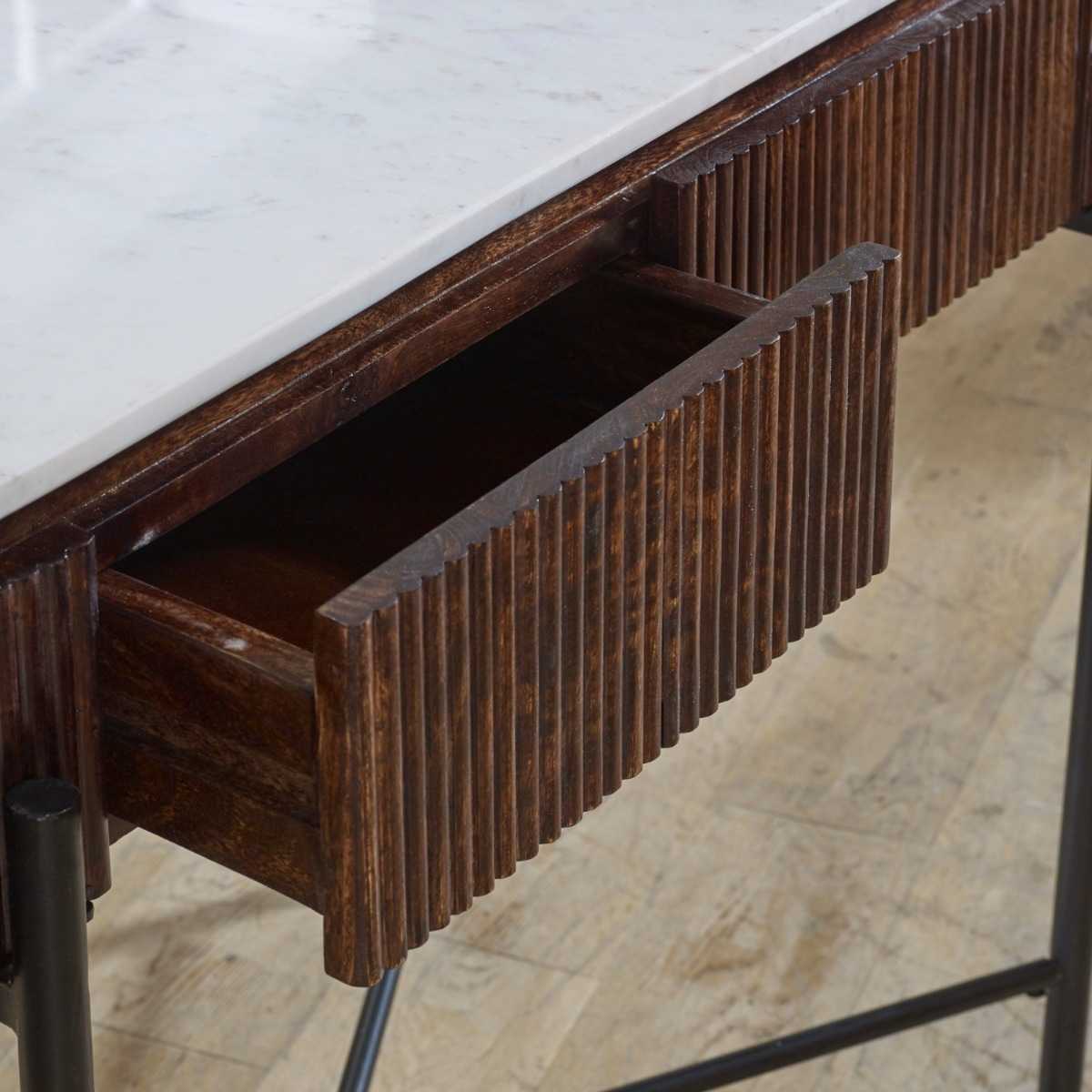 The handmade Opal Console Table with smooth marble top nests within a beautifully fluted mango wood frame, all supported by refined metal legs. H77×W120×D40 cm. Shop online today at www.nobleandnook.co.uk