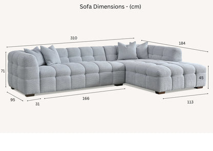 Shop the Tribeca Corner Sofa, featuring deep channel stitching and upholstered in a stunning iron boucle fabric. A modern twist on the classic Chesterfield design. Shop online today at www.nobleandnook.co.uk