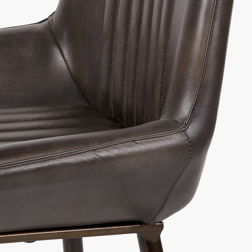 Upholstered in Vintage Dark Brown Leather with ribbed back cushioning. Vintage style and modern functionality. A refined addition to any dining setting or living space. Available today at www.nobleandnook.co.uk