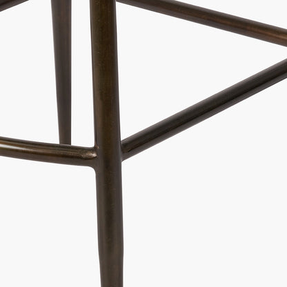 Upholstered in deep peppercorn-toned leather with ribbed cushioning and bronze metal frame, this handcrafted bar stool offers both comfort and visual impact. Shop online today at www.nobleandnook.co.uk