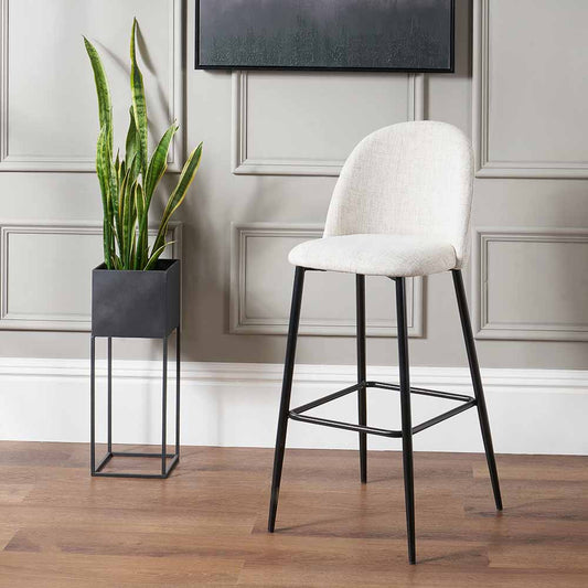 Refine your space with the Turi Pebble Linen Mix and Black Metal Bar Stool with gently curved backrest and soft pebble-toned linen mix upholstery. Shop online today at www.nobleandnook.co.uk
