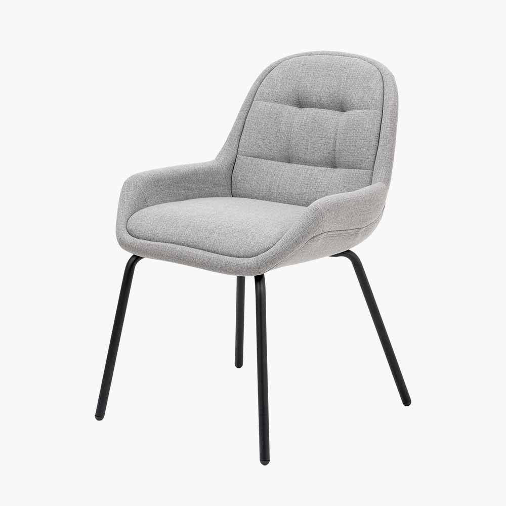 The Alba Dining Chair, upholstered in a soft grey linen mix with a stitched back and slender black metal legs ensures it complements any décor. Shop online today at www.nobleandnook.co.uk