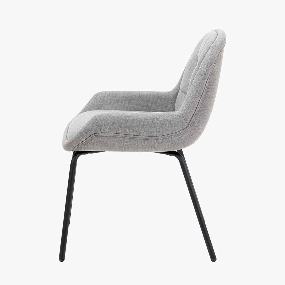 The Alba Dining Chair, upholstered in a soft grey linen mix with a stitched back and slender black metal legs ensures it complements any décor. Shop online today at www.nobleandnook.co.uk