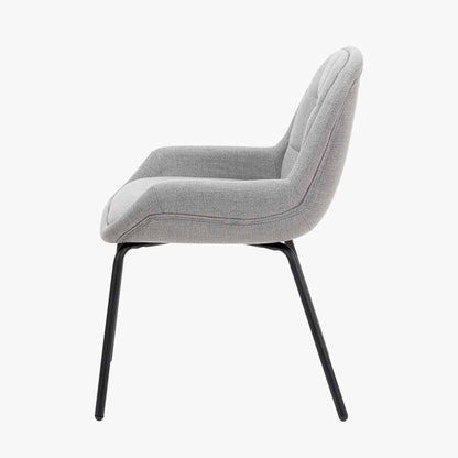 The Alba Dining Chair, upholstered in a soft grey linen mix with a stitched back and slender black metal legs ensures it complements any décor. Shop online today at www.nobleandnook.co.uk