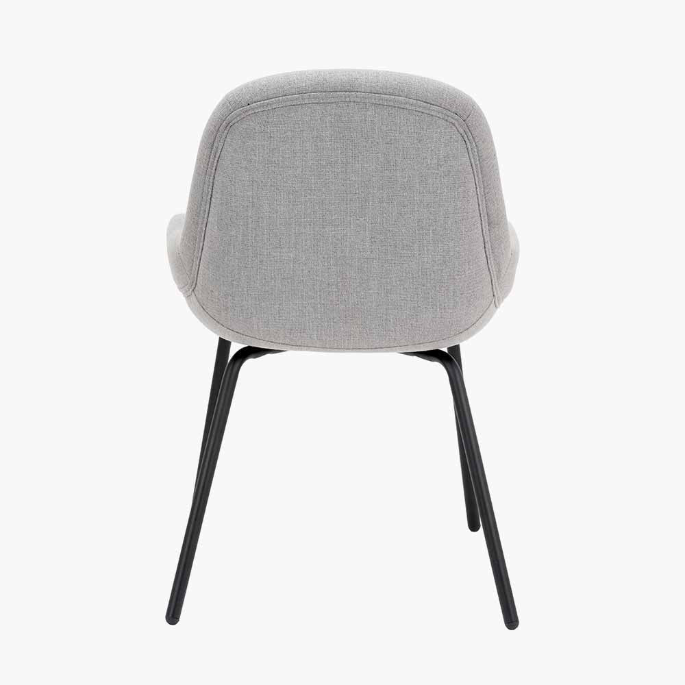 The Alba Dining Chair, upholstered in a soft grey linen mix with a stitched back and slender black metal legs ensures it complements any décor. Shop online today at www.nobleandnook.co.uk