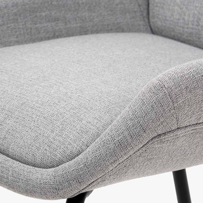 The Alba Dining Chair, upholstered in a soft grey linen mix with a stitched back and slender black metal legs ensures it complements any décor. Shop online today at www.nobleandnook.co.uk