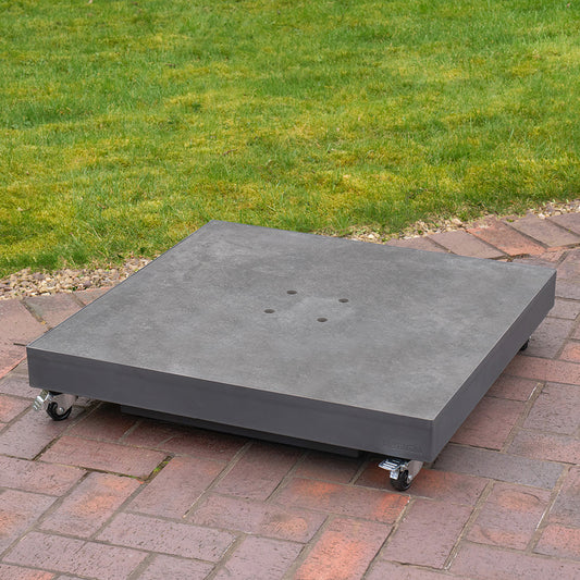 Large gray platform with wheels on a brick patio