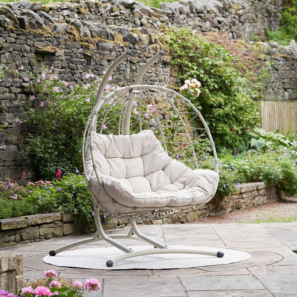 Double Seater Hanging Garden Chair. Shown loctaed in a walled garden
