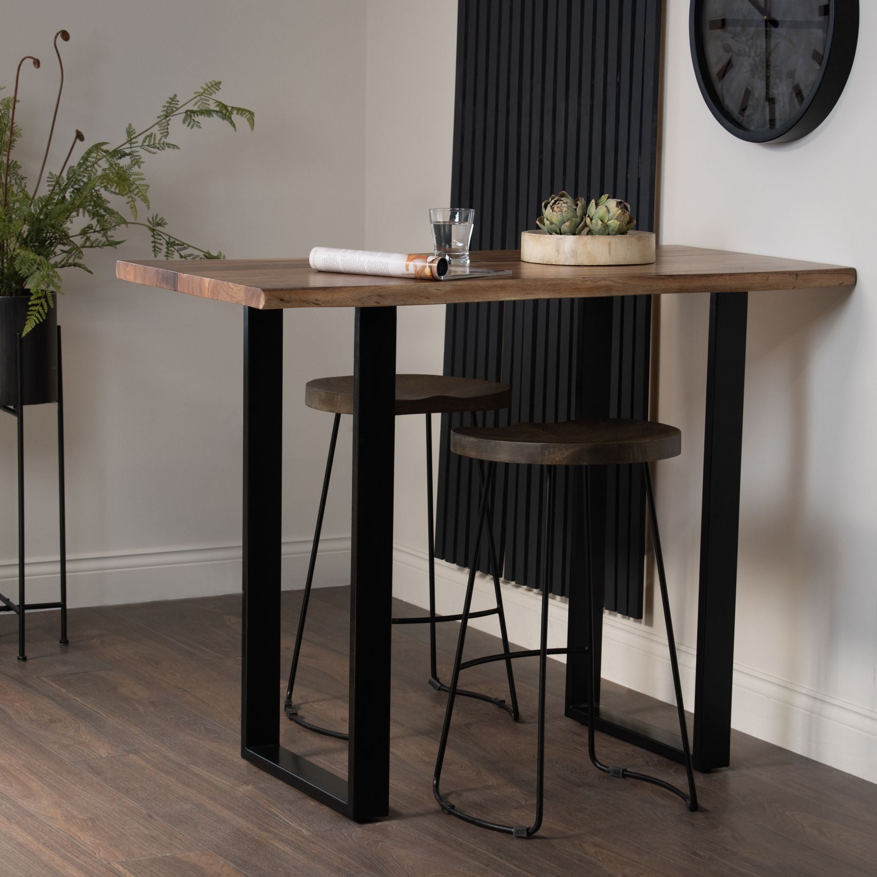 The Live Edge Small Bar Table is a stunning centrepiece for any home bar or entertainment space. Crafted from Indian hardwood (acacia) paired with a sleek metal base. Shop online today at www.nobleandnook.co.uk