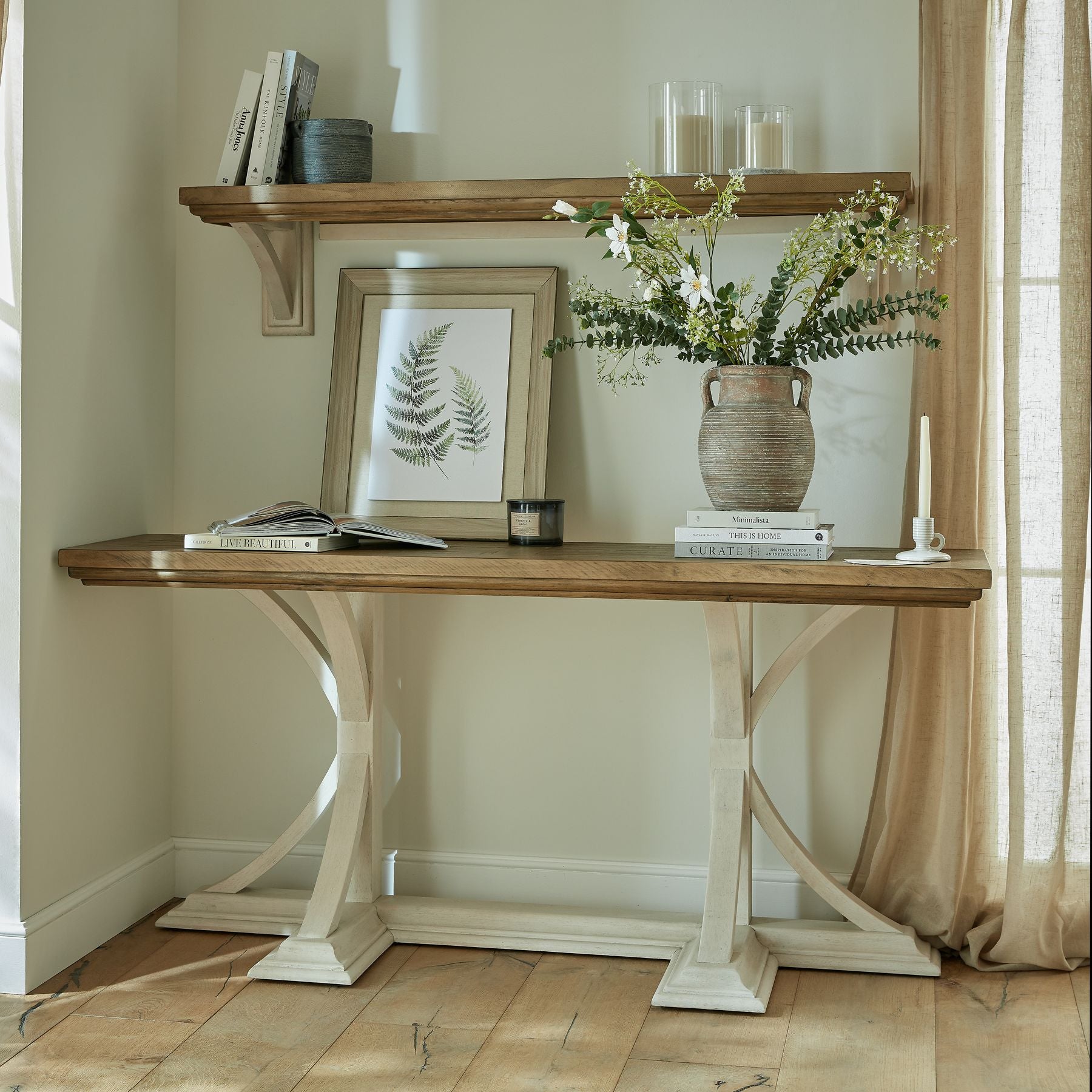 Shop the Luna Console Table featuring natural wood grain and an off-white painted base to create a striking contrast. The perfect balance of rustic charm and contemporary appeal. Shop online today at www.nobleandnook.co.uk