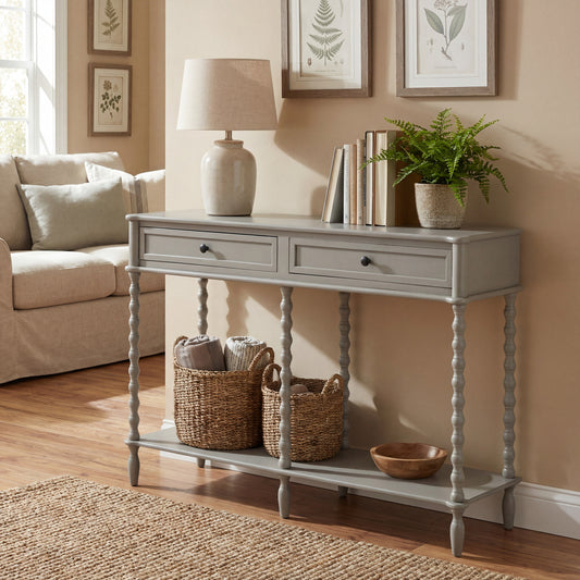 Grey console table in a living room with decor items