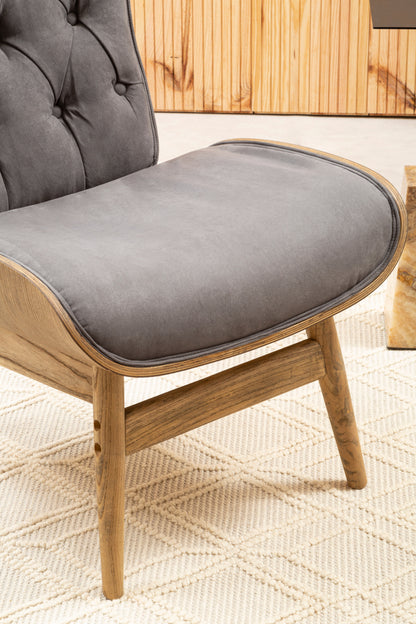Shop the Dark Grey Velvet Chair with Winged Back, a touch of timeless elegance to any room. A tufted velvet seat, sleek winged design, and sturdy elmwood frame. SHop online today at www.nobleandnook.co.uk
