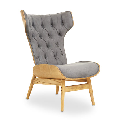 Shop the Dark Grey Velvet Chair with Winged Back, a touch of timeless elegance to any room. A tufted velvet seat, sleek winged design, and sturdy elmwood frame. SHop online today at www.nobleandnook.co.uk