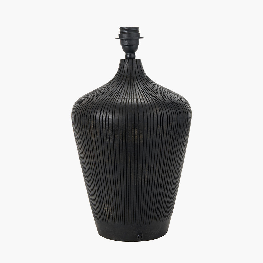 Black ribbed vase-like lamp on a white background