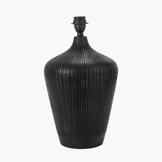 Black ribbed vase-like lamp on a white background