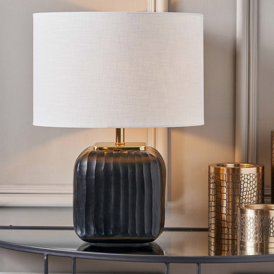 The Anais Table Lamp featuring a distinctive square glass base in rich matt black with artisan quality. Ideal for living rooms, bedrooms, or entryways. Available at www.nobleandnook.co.uk