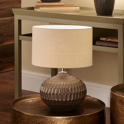 Shop the Cassius Bronze Table Lamp with a layered bronze ceramic base and hand-applied metallic finish. FREE UK MAINLAND DELIVERY. Shop online now at www.nobleandnook.co.uk